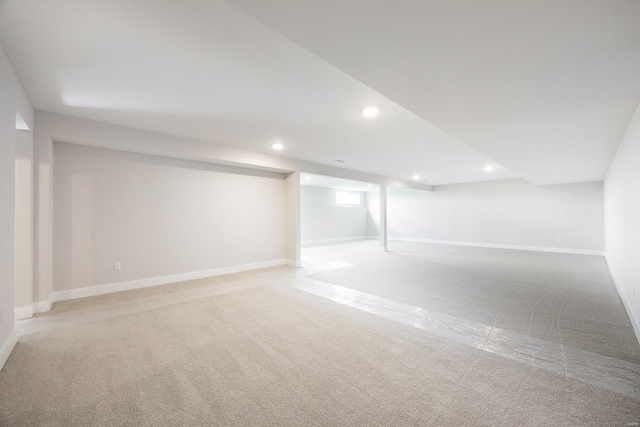 basement with light colored carpet