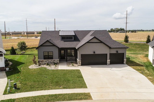 view of front facade with a front yard and a garage