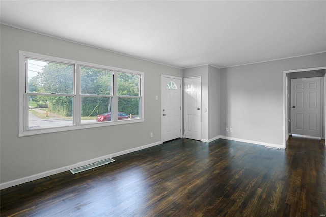 entrance foyer with dark hardwood / wood-style floors