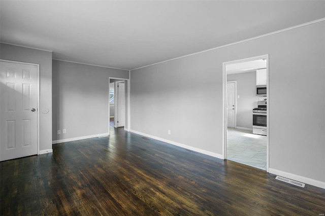 unfurnished room with wood-type flooring and crown molding