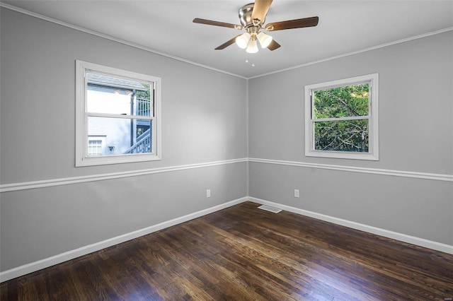 unfurnished room featuring crown molding, dark hardwood / wood-style flooring, ceiling fan, and plenty of natural light