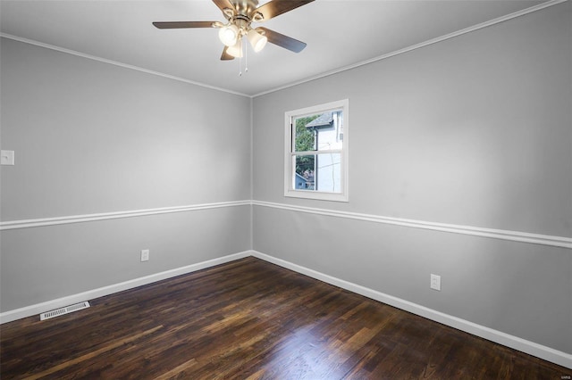 unfurnished room featuring ceiling fan, crown molding, and dark hardwood / wood-style flooring