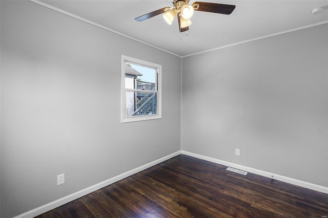 unfurnished room featuring ornamental molding, ceiling fan, and dark hardwood / wood-style flooring