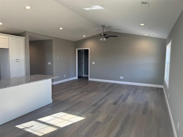 unfurnished living room with dark wood-type flooring, ceiling fan, and lofted ceiling