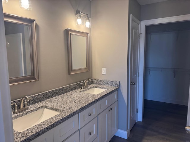 bathroom featuring vanity and hardwood / wood-style flooring