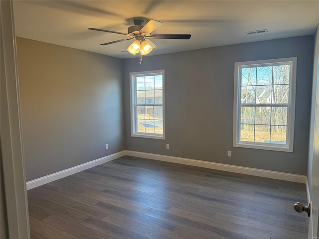 unfurnished room featuring dark hardwood / wood-style flooring and ceiling fan