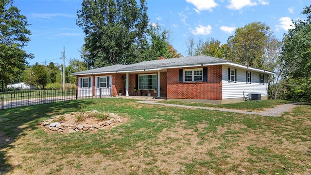 ranch-style home featuring a front yard and central air condition unit