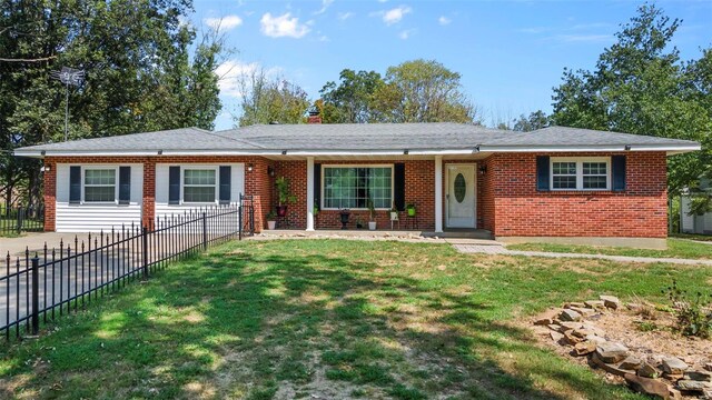 ranch-style house with a front yard