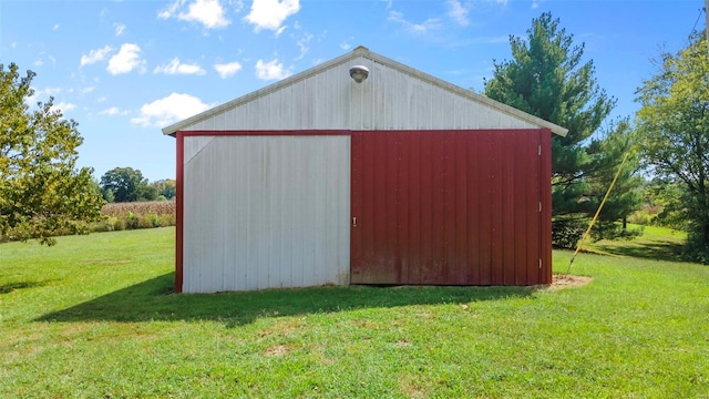 view of outbuilding featuring a lawn