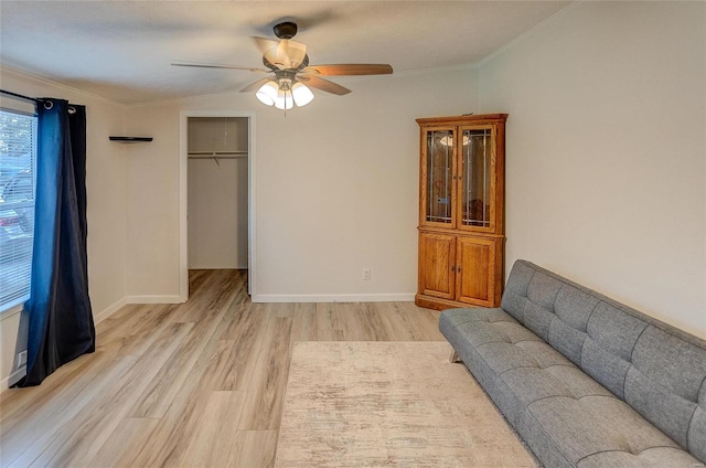 unfurnished living room with light wood-type flooring, crown molding, vaulted ceiling, and ceiling fan