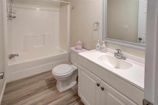 full bathroom with wood-type flooring, shower / bath combination, vanity, and toilet