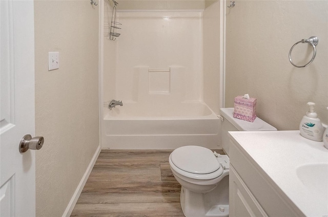 full bathroom featuring vanity, hardwood / wood-style floors, toilet, and shower / bathtub combination