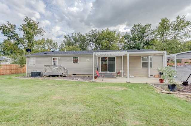 back of house with a lawn, a patio, and central AC unit