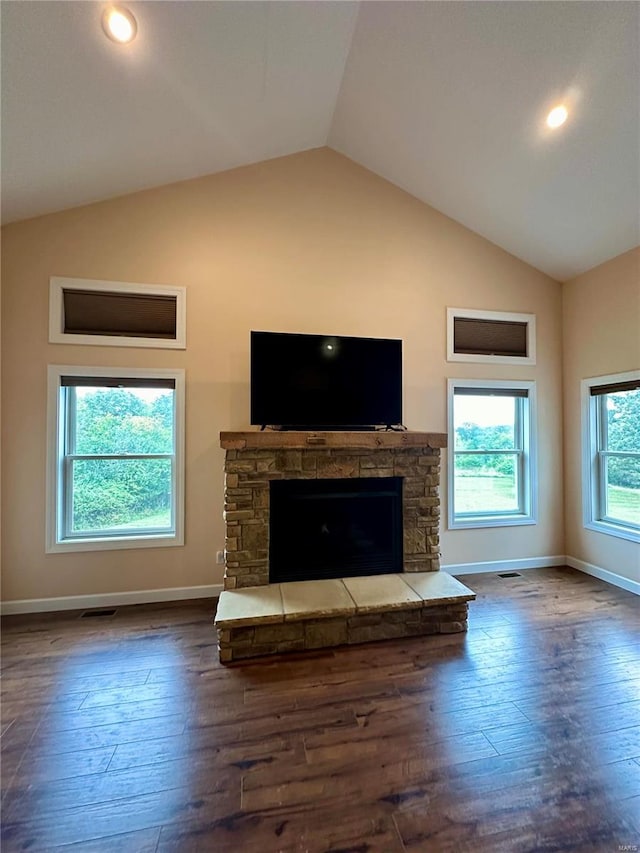 unfurnished living room featuring lofted ceiling, a fireplace, and dark hardwood / wood-style flooring