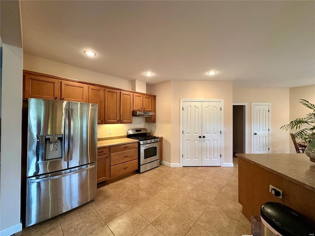 kitchen with stainless steel appliances and light tile patterned floors