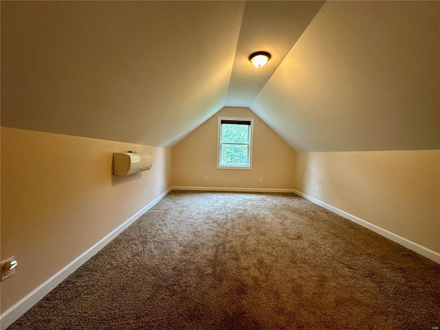 bonus room with lofted ceiling, carpet flooring, and a wall unit AC