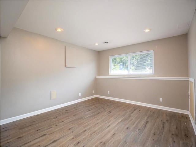 empty room with wood-type flooring