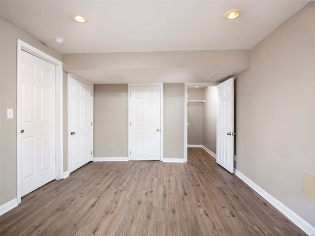 unfurnished bedroom featuring hardwood / wood-style flooring