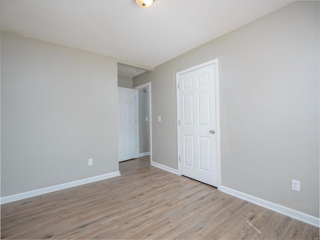 empty room with light wood-type flooring