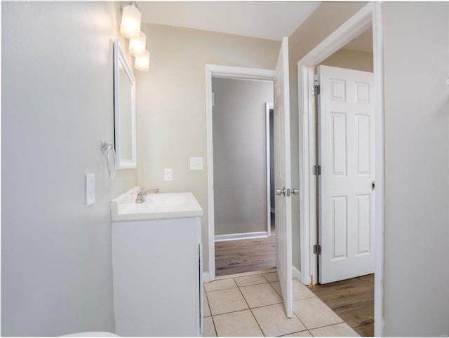 bathroom with wood-type flooring and vanity