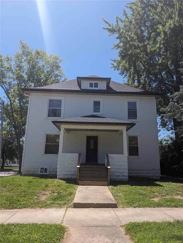 view of front of home featuring a porch and a front yard