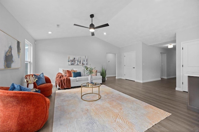 living room featuring ceiling fan, vaulted ceiling, and hardwood / wood-style floors