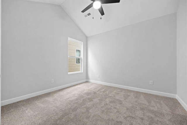 unfurnished room with lofted ceiling, ceiling fan, and carpet flooring