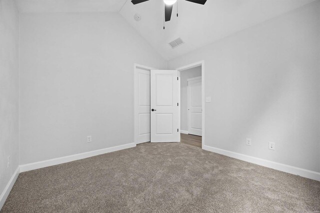 unfurnished room with carpet, ceiling fan, and high vaulted ceiling