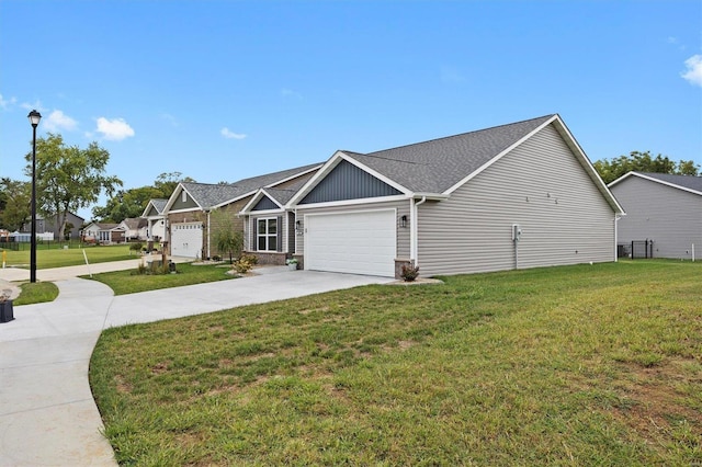 view of front of property featuring a garage and a front lawn