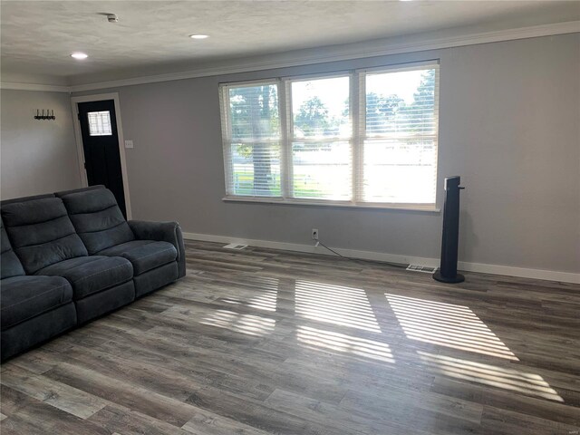 living room featuring ornamental molding and dark hardwood / wood-style flooring