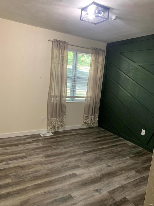 empty room featuring dark hardwood / wood-style floors