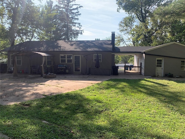 rear view of house with a yard