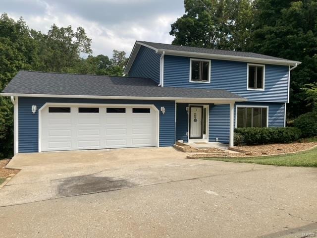 front of property featuring a garage