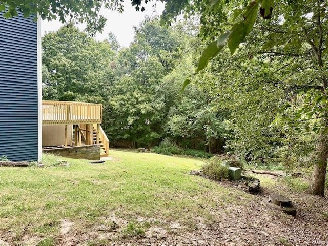 view of yard with a wooden deck