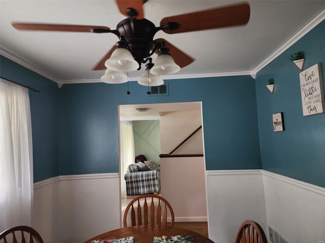 dining room featuring crown molding and wood-type flooring