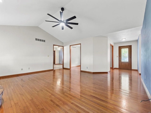 unfurnished living room featuring hardwood / wood-style flooring, ceiling fan, and lofted ceiling