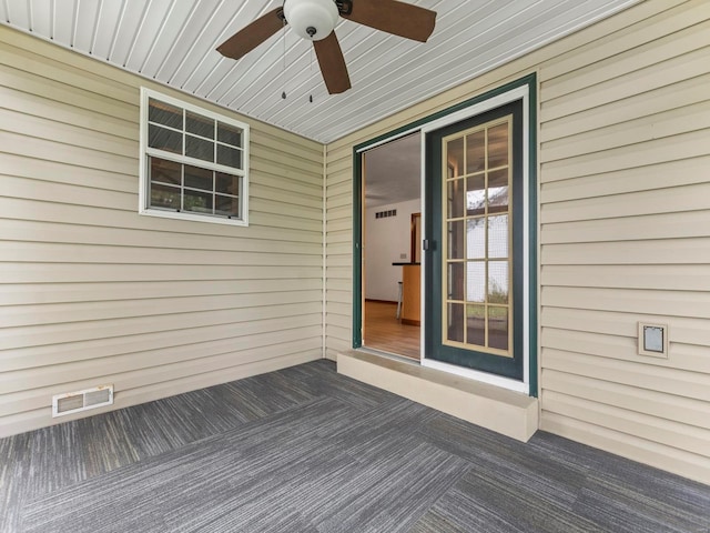 wooden terrace featuring ceiling fan