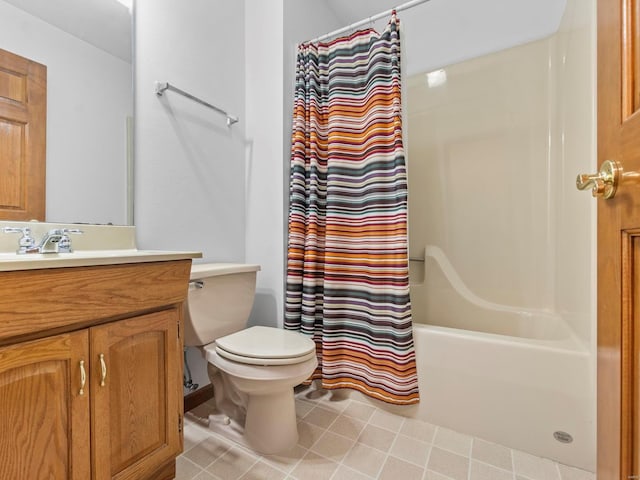 full bathroom with tile patterned floors, vanity, shower / tub combo, and toilet