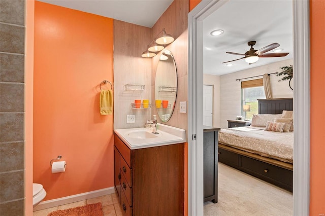 bathroom featuring vanity, tile patterned floors, toilet, and ceiling fan