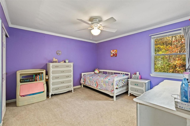 bedroom featuring crown molding, carpet floors, and ceiling fan