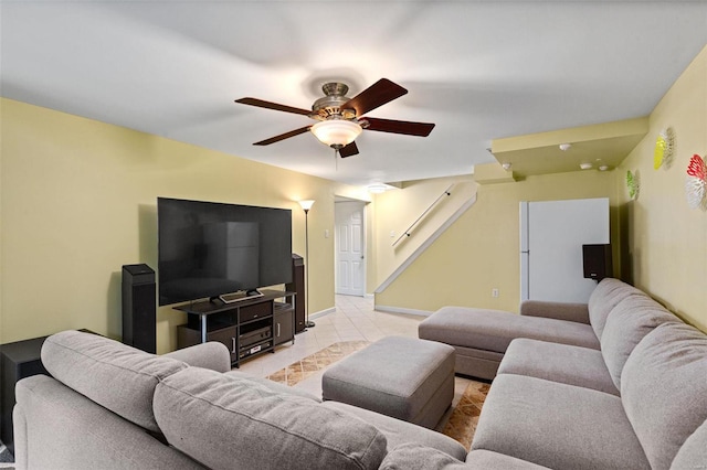 living room featuring ceiling fan and light tile patterned floors