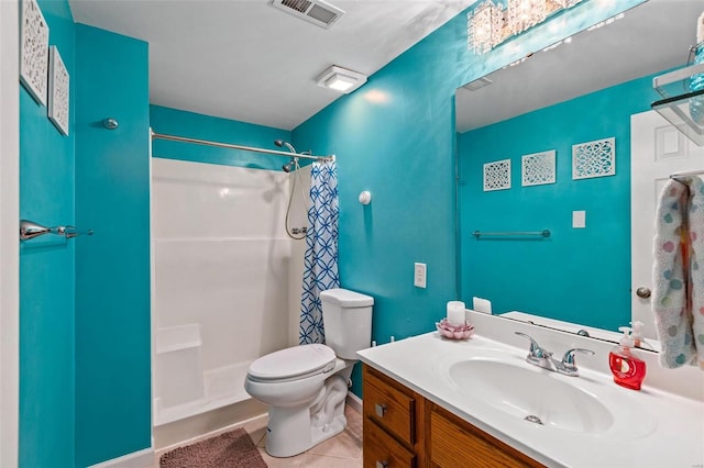 bathroom with toilet, vanity, a shower with shower curtain, and tile patterned flooring