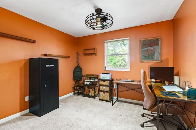 carpeted office space with ceiling fan