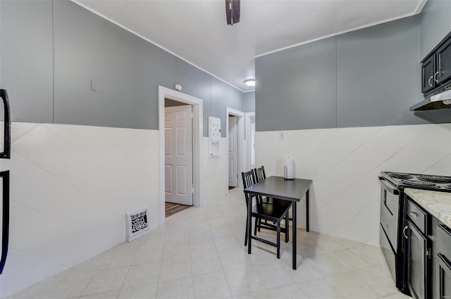 dining area with tile walls