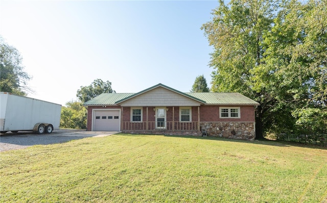 single story home with a front yard and a garage