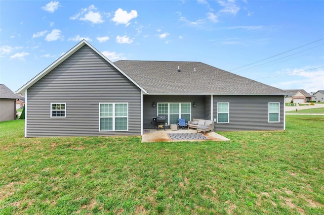 back of property featuring an outdoor hangout area, a yard, and a patio area