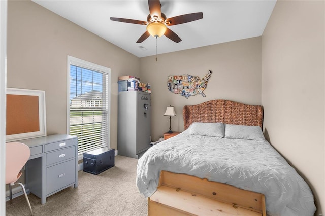 bedroom with ceiling fan, refrigerator, and light carpet