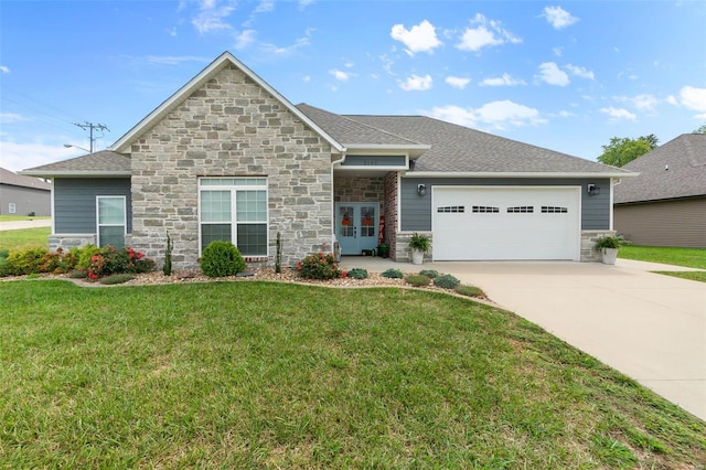 view of front of property with a front lawn and a garage