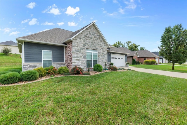 view of front of property with a garage and a front lawn