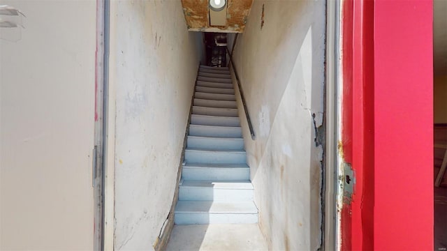 stairs with concrete floors